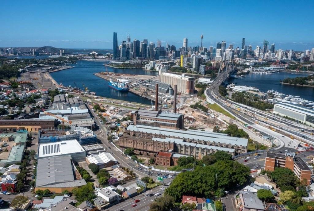 Aerial view over Sydney Harbour, the CBD skyline and inner-city industrial precinct