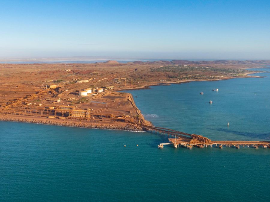 Aerial view of Karratha industrial coastline with export wharf and conveyor infrastructure
